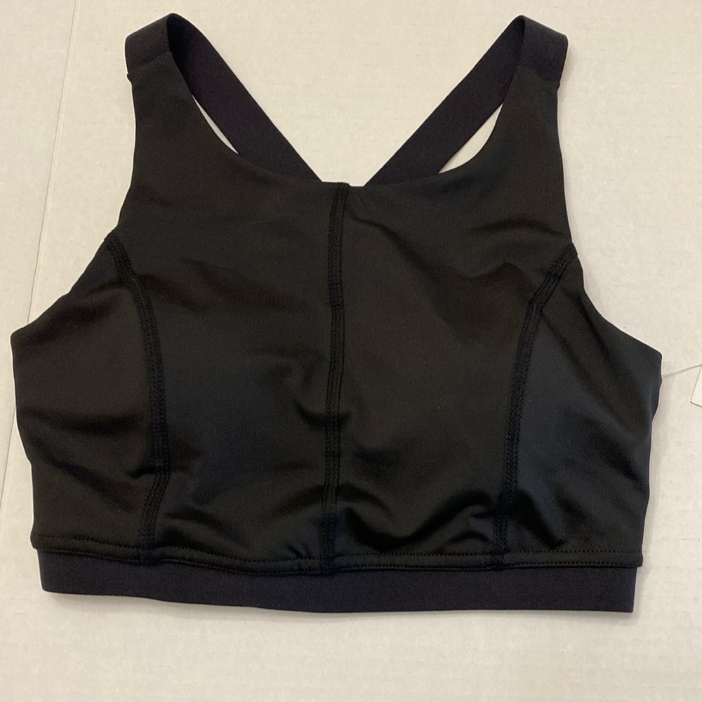 NWT PSK black sports bra. High impact with wide elastic straps. Size XS